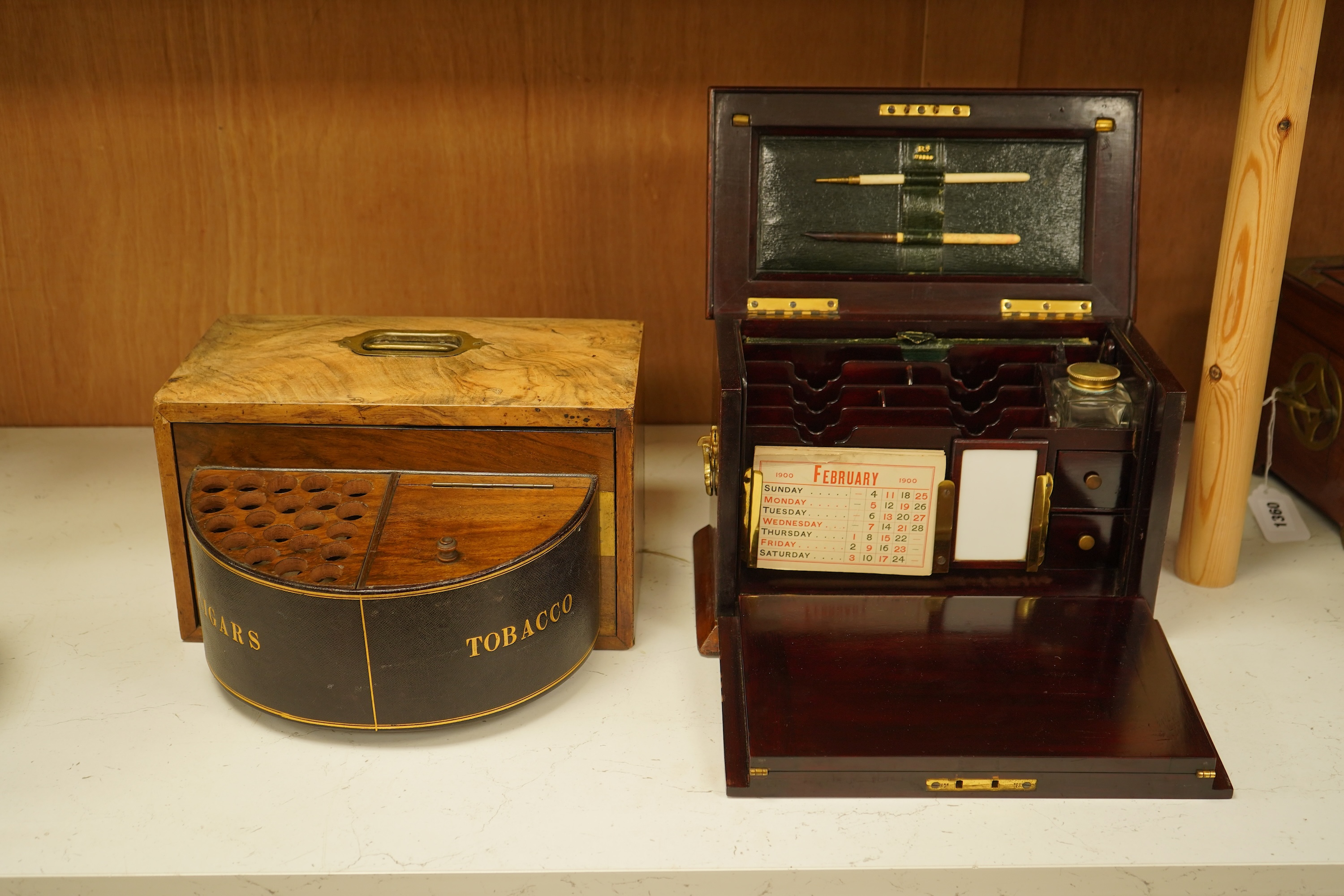 An Edwardian inlaid mahogany writing casket with fitted interior and a late Victorian faded walnut cigar box, largest 32cm wide